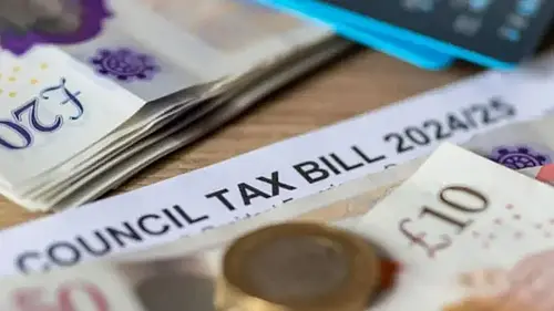 money on table next to council tax bill