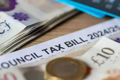 money on table next to council tax bill