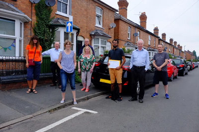 Cllrs Kaleem Aksar and Neville Mills meet with local residents to promote their parking petition